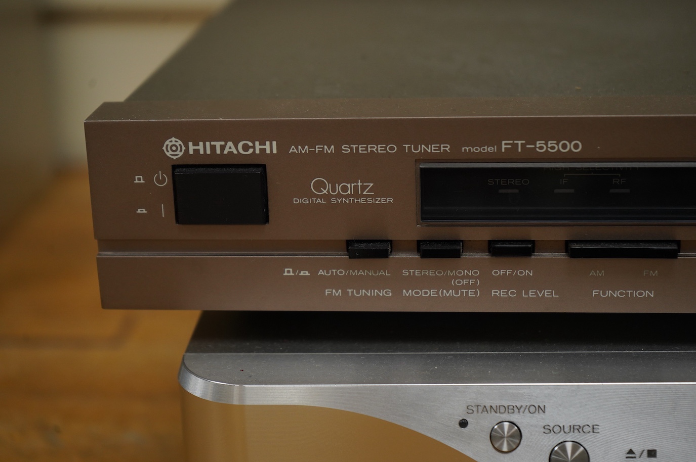An Esoteric RZ-1 Integrated Music System, amplifier SACD/CD player, together with a Hitachi FT-5500 AM/FM stereo tuner, plus cables.